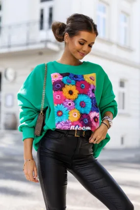 Maglia felpa oversize verde in cotone con stampa floreale multicolore e bordi polsini elasticizzati